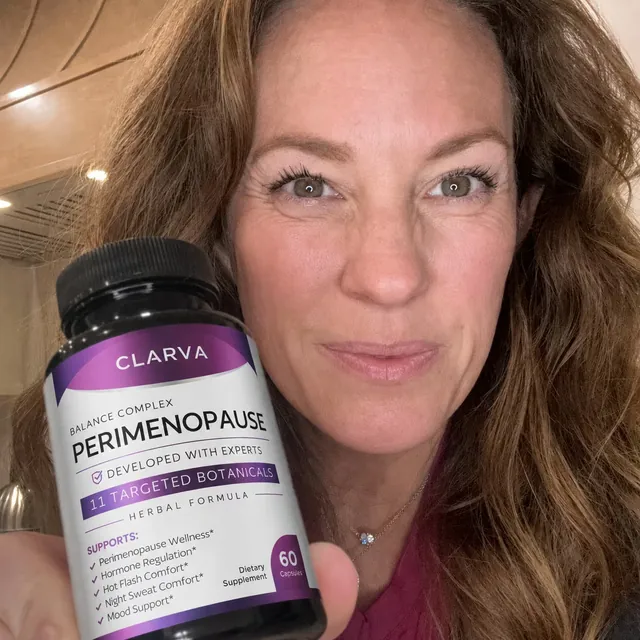 A person holding a CLARVA PERIMENOPAUSE bottle